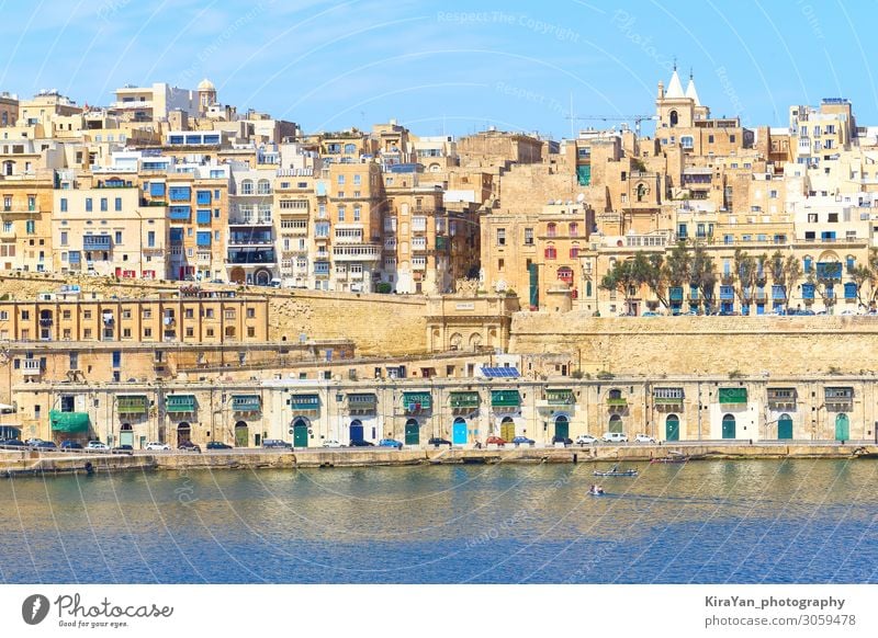 General view of ancient Valletta waterfront with Victoria Gate from water point malta valetta valletta victoria gate grand harbour architecture blue boat