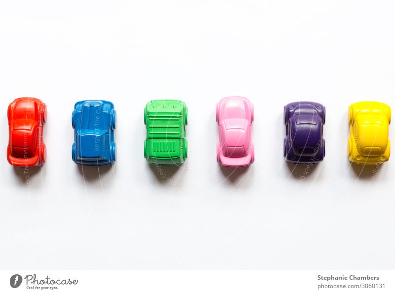 Six coloured crayon cars horizontally aligned. Car Multicoloured Motor vehicle colourful flatlay Colour back to school Colour photo
