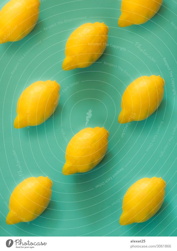 Lemon pattern on green background Fruit Design Summer Fashion Collection Simple Fresh Above Yellow Colour assortment citrus colorful flat lay food green bright