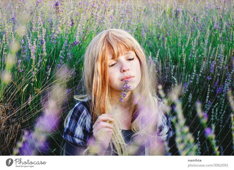 Young woman enjoying the day in a field of lavender Herbs and spices Lifestyle Beautiful Face Cosmetics Alternative medicine Medication Relaxation Human being