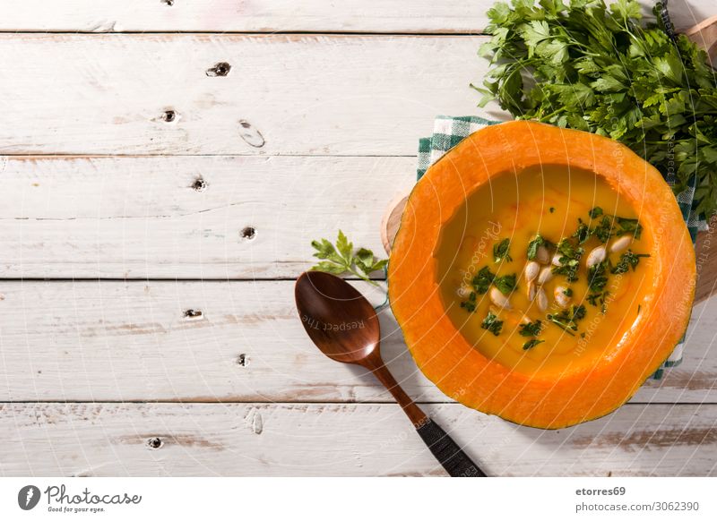 Pumpkin and carrot soup on wooden table. Autumn food. Soup Food Healthy Eating Food photograph Vegetable Carrot Liquid Thanksgiving Christmas & Advent Cream