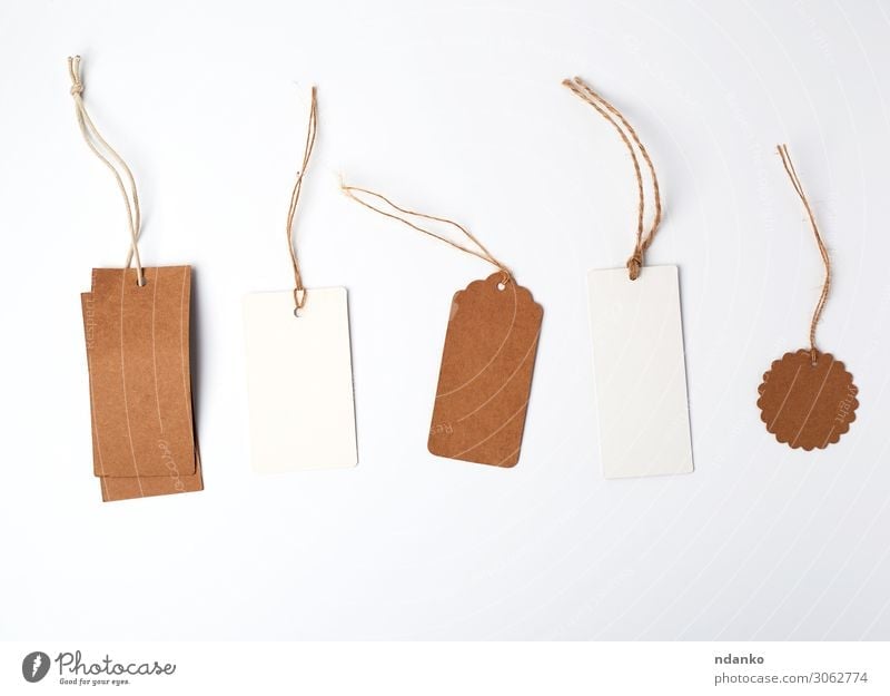 Four Brown Tags Hanging On Ropes Stock Photo - Download Image Now