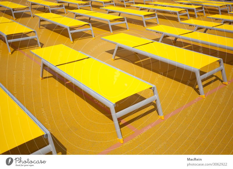 sunbeds Relaxation Calm Vacation & Travel Tourism Cruise Summer Sun Lie Yellow Deckchair Beaded Side by side Behind one another Deserted Colour photo