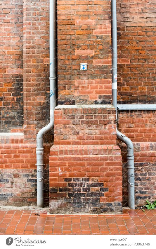 Two rainwater pipes at a listed church made of red brick somewhere in northern Germany Church Brick Brick facade Brick wall Close-up Rainwater pipes Downspout