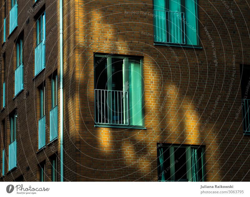 Light reflection on a brick building with many windows Town Capital city Port City House (Residential Structure) Factory Manmade structures Building