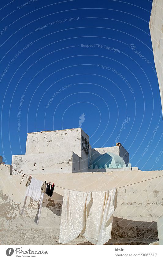 Laundry on clothesline, in front of house in Morocco. Beautiful weather Clothing T-shirt White Clothesline Day