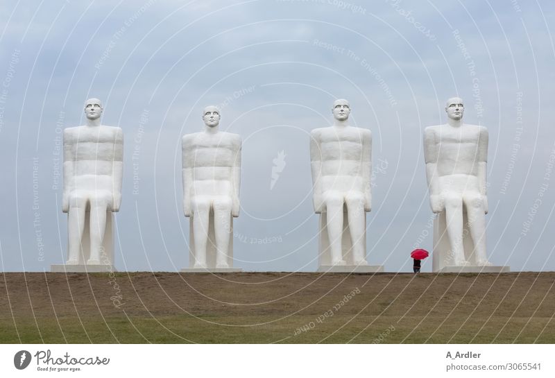 Four oversized human figures with red umbrella Art Work of art Sculpture Culture Manmade structures Tourist Attraction Landmark Monument Man by the sea Stone