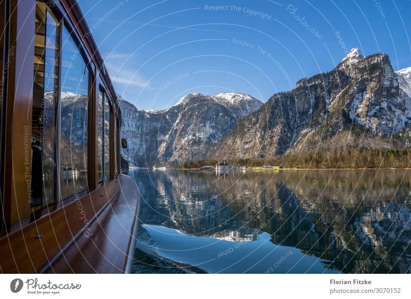 A boat trip on Lake Königssee in the Berchtesgaden NP Nature Landscape Water Cloudless sky Beautiful weather Alps Mountain Peak Snowcapped peak Lakeside