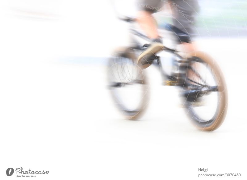 racy cyclist on the way in a sports park with motion blur Sports Cycling Bicycle Sporting Complex Human being Youth (Young adults) Legs 1 13 - 18 years Pants