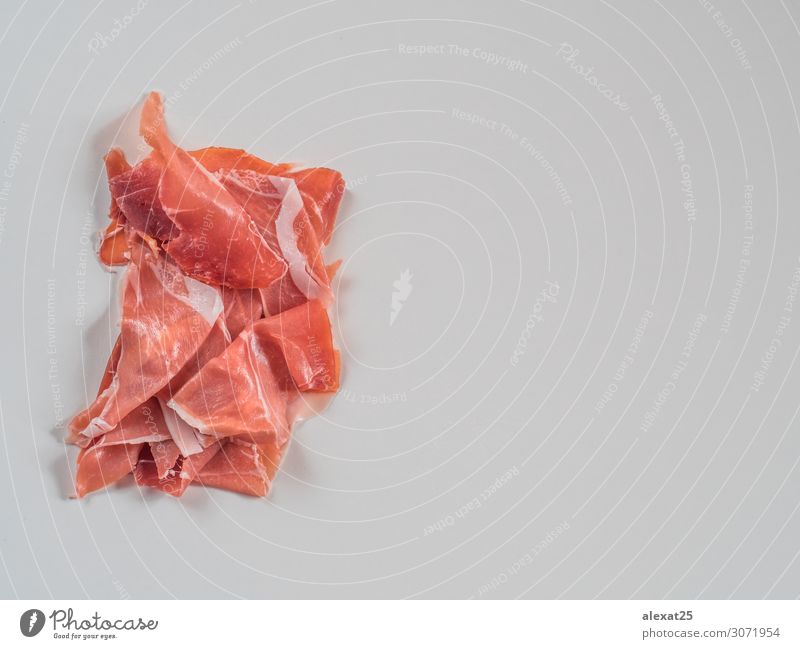 Serrano ham on white background with copy space Meat Plate Thin Red White Colour Tradition appetizer Copy Space Cooking cured Delicatessen fat food Gourmet Ham