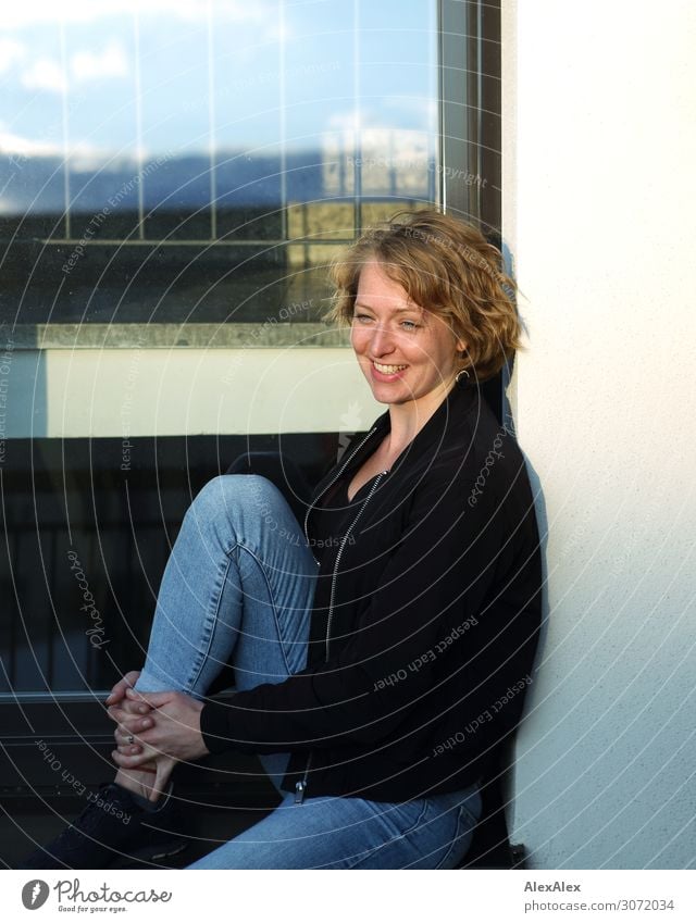 Young woman sitting on the terrace and is happy Style already Harmonious Well-being Window Banister Youth (Young adults) 18 - 30 years Adults Summer