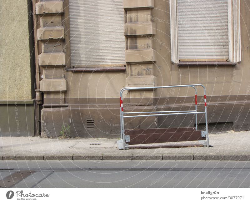 closing time House (Residential Structure) Wall (barrier) Wall (building) Facade Window Roller shutter Old Dirty Gloomy Town Gray Red Silver Transience