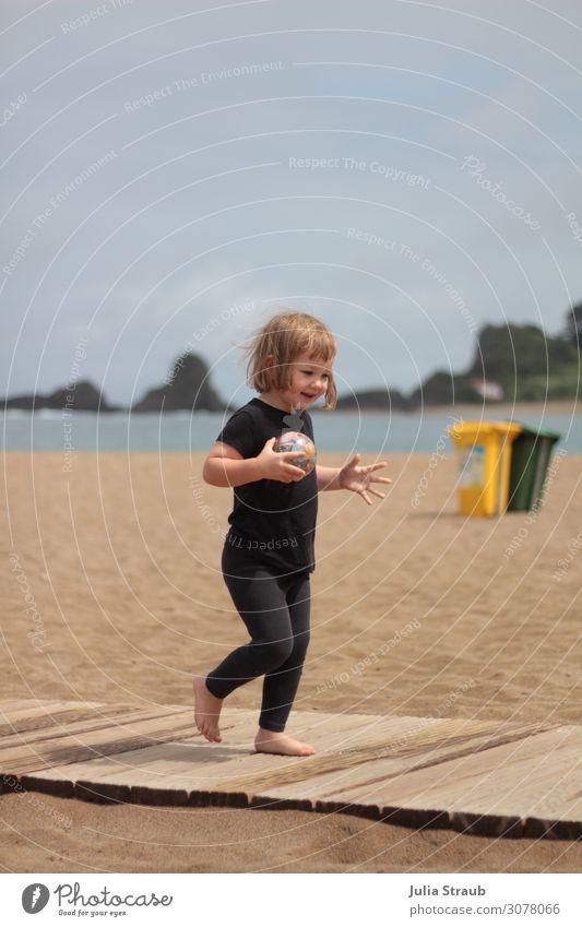 toddler beach garbage walk Nature Summer Beautiful weather Coast Beach T-shirt Brunette Blonde Short-haired Bangs To hold on Smiling Running Speed Happiness