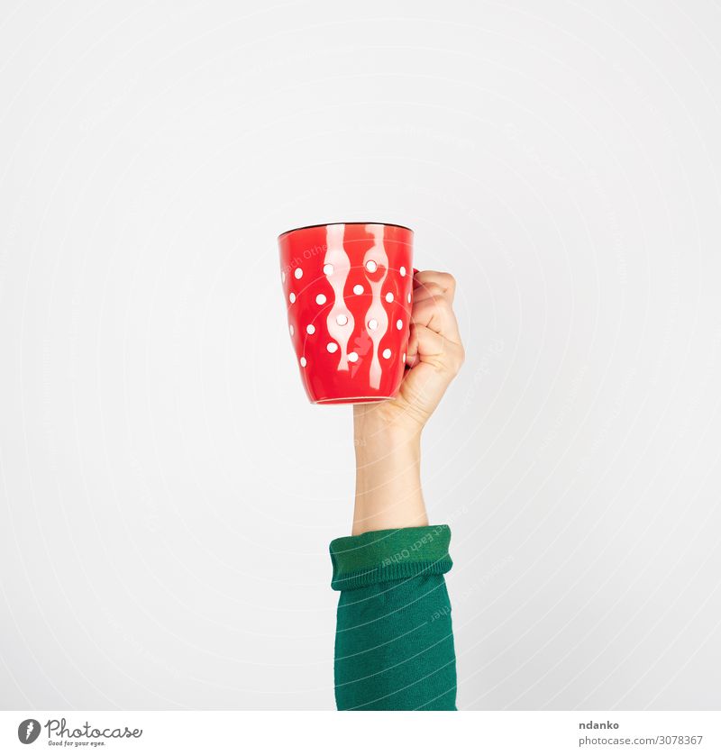 red ceramic cup in a female hand on a white background Breakfast Beverage Coffee Espresso Tea Design Kitchen Human being Woman Adults Arm Hand Fingers Green Red