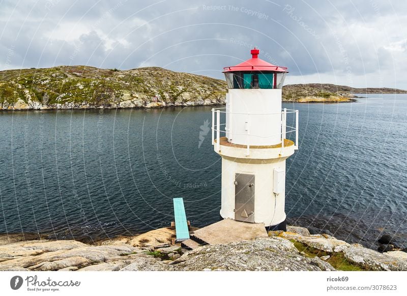 Lighthouse in Mollösund in Sweden Relaxation Vacation & Travel Tourism Summer Ocean Island Nature Landscape Water Clouds Rock Coast North Sea Village Building