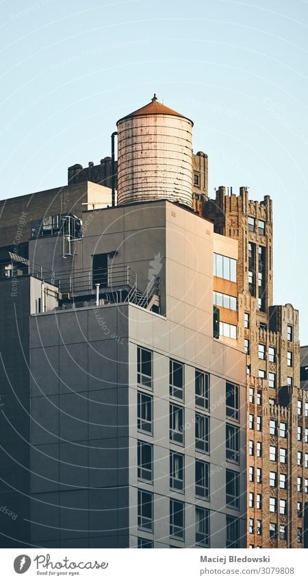 Retro toned picture of a water tower on a rooftop, NY. City trip Living or residing Flat (apartment) House (Residential Structure) Building Architecture Roof