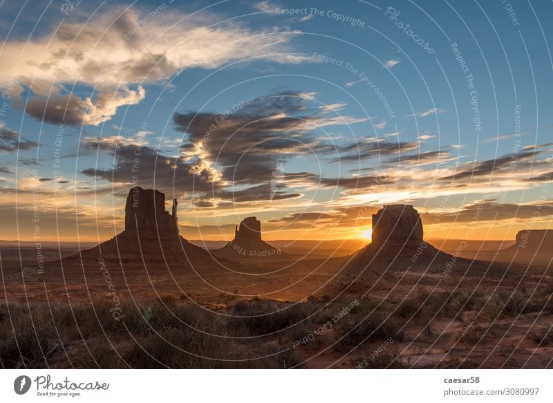 Sunrise at Monument Valley 01 Nature Landscape Sunset Sunlight Warmth Desert Sand Beautiful Blue Gold Orange USA National Park Mountain Holy Clouds Colour photo