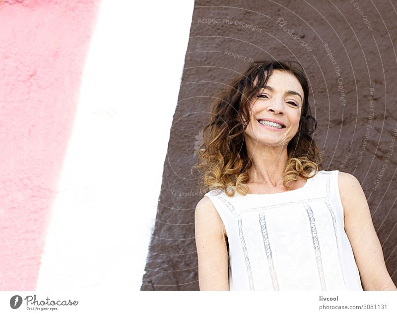 adult woman smiling in front a pink wall , san sebastian Lifestyle Happy Beautiful Face Relaxation Calm Human being Woman Adults Art Building Facade Street