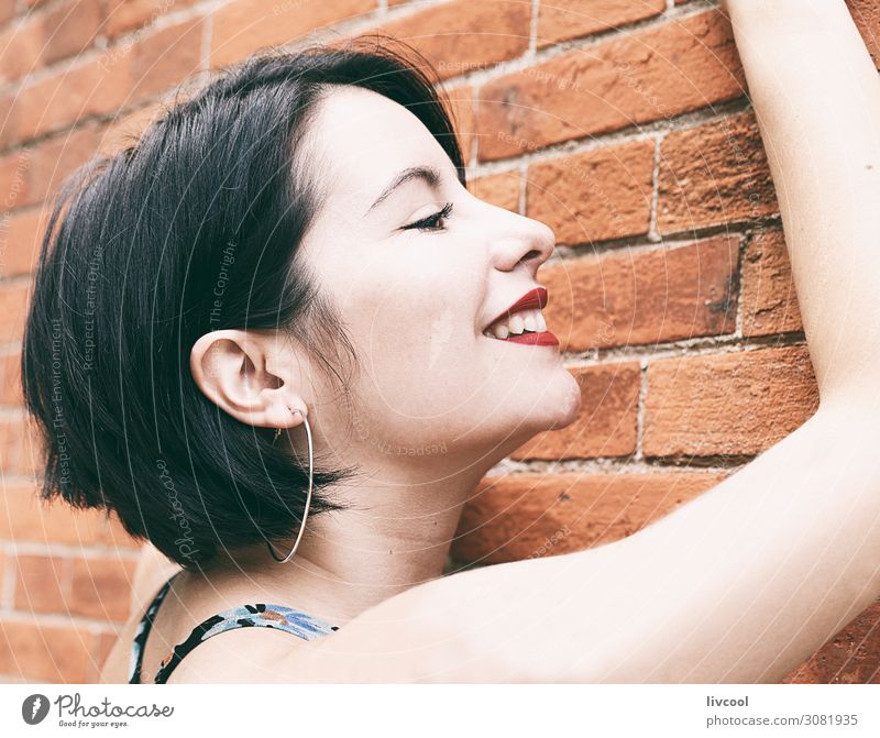 Smiling young woman against a brick wall, San Sebastian-Spain Lifestyle Elegant Style Happy Beautiful Face Summer Human being Feminine Homosexual Young woman
