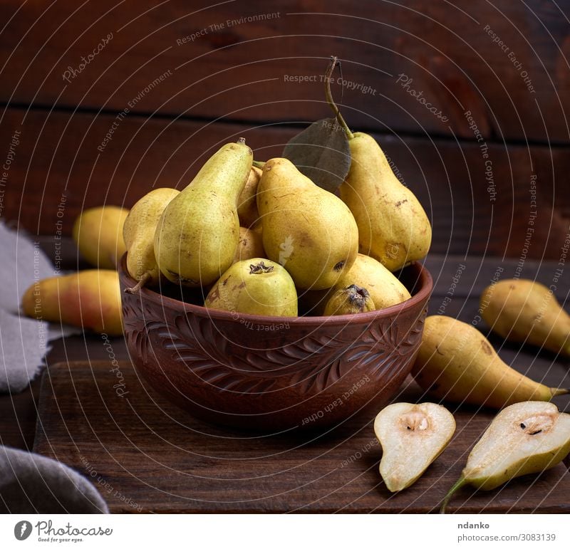 fresh ripe green pears in a brown clay bowl on a table Fruit Nutrition Vegetarian diet Diet Plate Bowl Table Nature Autumn Wood Old Fresh Delicious Natural