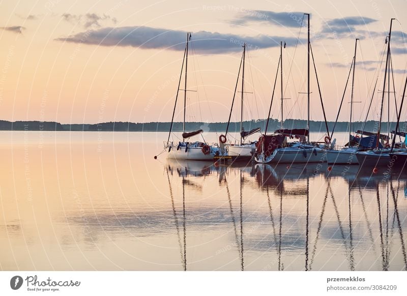 Yachts and boats moored in a harbour Relaxation Leisure and hobbies Vacation & Travel Tourism Cruise Summer Ocean Nature Coast Lake Harbour Sailboat Watercraft