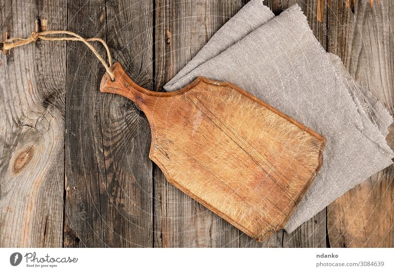 empty old brown wooden cutting board with handle Design Kitchen Wood Old Dirty Dark Natural Above Retro Brown Gray Ancient background Blank chopping cooking