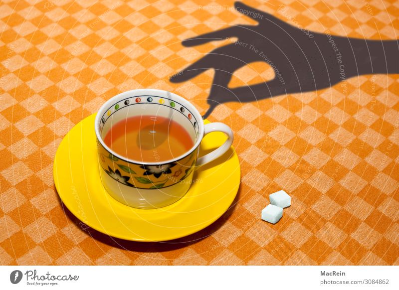 teacup Breakfast Hot drink Tea Cup Spoon Hand Drinking Sugar Plate Stir Tablecloth Shadow Colour photo Interior shot