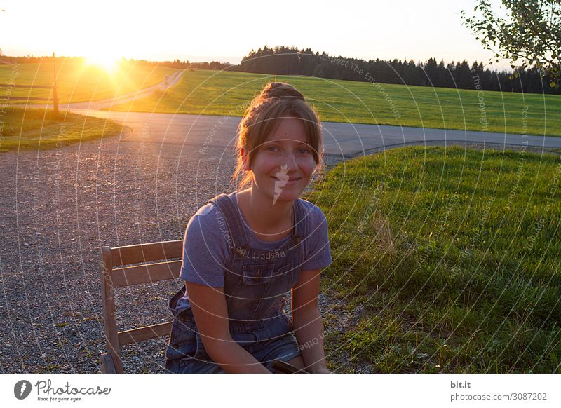 Young woman against the light Feminine Girl Youth (Young adults) Joy Happy Happiness Contentment Joie de vivre (Vitality) Dusk Looking Looking into the camera