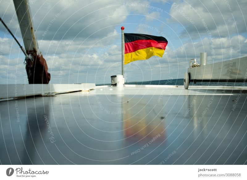 Black red gold in the wind on the Müritz Trip German Flag Clouds Boating trip Glittering Maritime Horizon Vacation & Travel Judder Tilt Bow Background picture