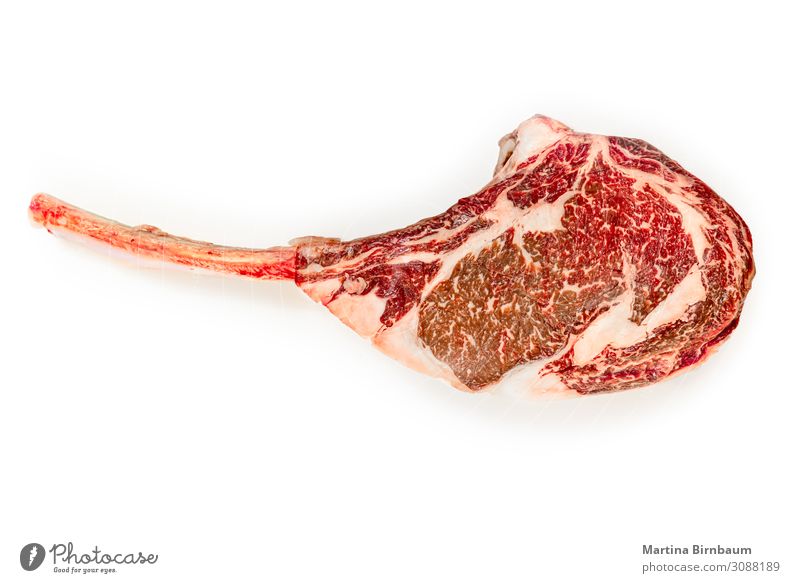 Dry aged raw tomahawk beef steak isolated on white background Meat Delicious Rich Red wagyu Ribeye Background picture angus dry bone wet bloody barbecue