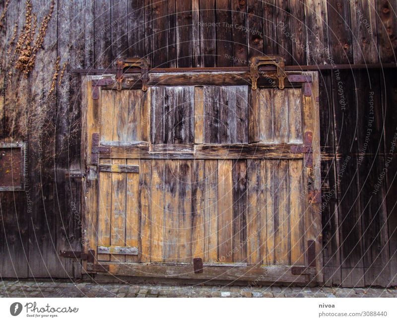 Old wooden gate Mountain Machinery Hut Barn Barn door Door Gate Vehicle Wood Utilize Discover Faded Authentic Dark Sustainability Brown Emotions Safety