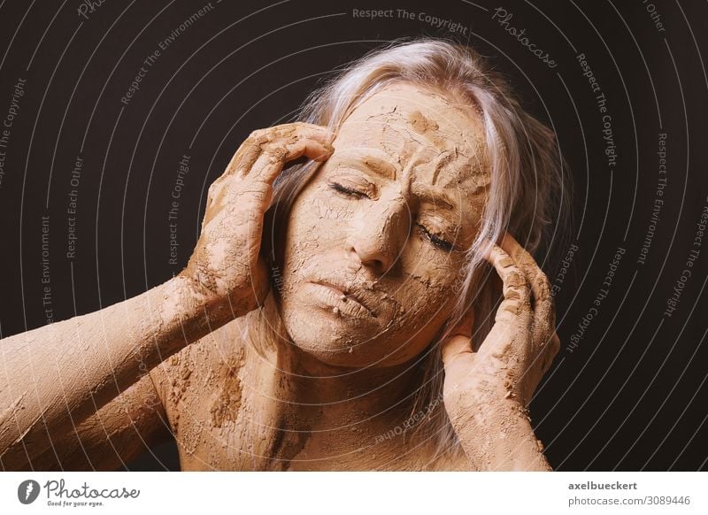 woman covered in dry cracked clay mud mask holding her head Beautiful Skin Face Healthy Illness Wellness Human being Young woman Youth (Young adults) Woman
