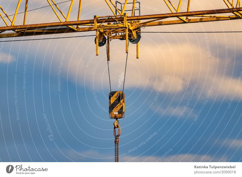 Construction crane with cloudy sky High-tech Manmade structures Building Architecture Metal Work and employment Blue Yellow Gold Black Society Force Town