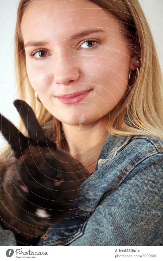Girl-teenager holding a rabbit in her arms Young woman Youth (Young adults) Face 1 Human being 13 - 18 years Animal Italy Europe Jacket Earring Brunette Pet