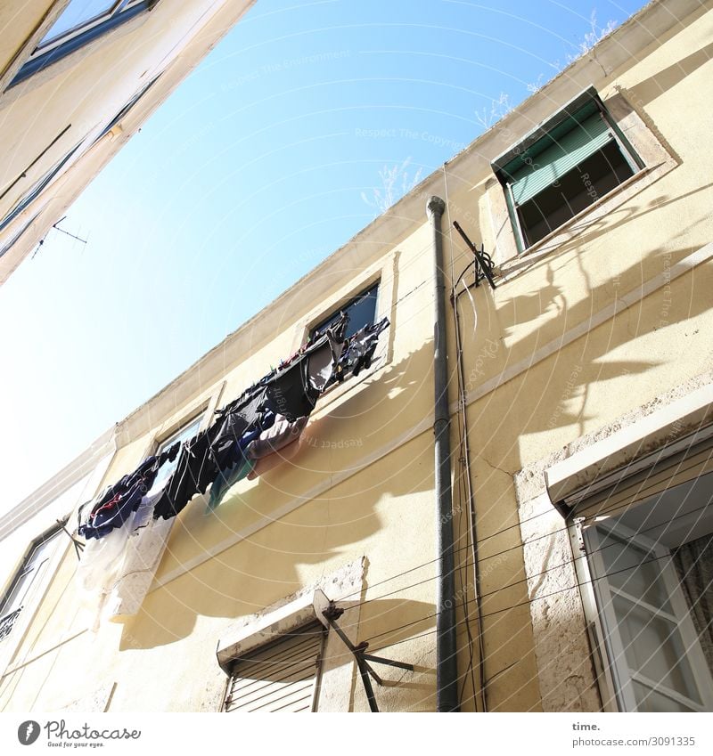 washed Sky Beautiful weather Lisbon House (Residential Structure) Wall (barrier) Wall (building) Facade Window Roof Eaves Clothesline Laundry Washing