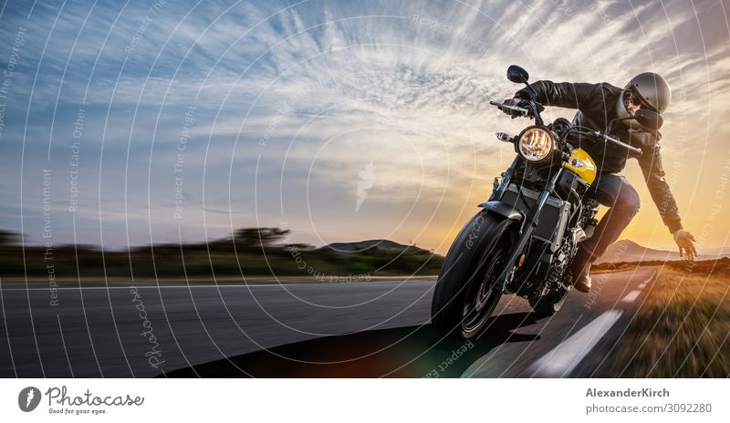 man on a motorbike on the road riding. Lifestyle Joy Vacation & Travel Sports Engines Human being Motorcycle Utilize Power motorcyclist rider race Sunset