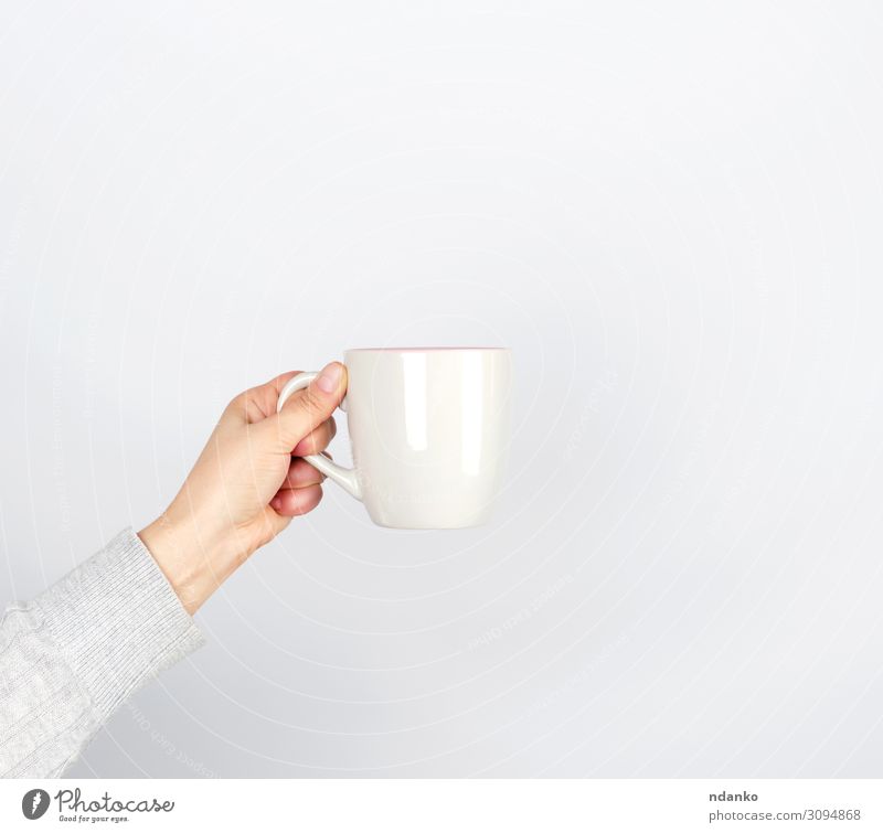 gray ceramic cup in female hand Breakfast Beverage Coffee Espresso Tea Cup Mug Design Kitchen Human being Woman Adults Arm Hand Fingers Container Hot Gray White