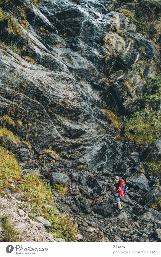 Hike in front of waterfall Vacation & Travel Adventure Mountain Hiking Young woman Youth (Young adults) Nature Landscape Beautiful weather Rock Alps Waterfall