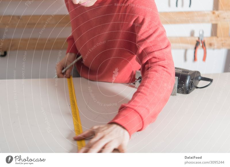 woman with tape measure ready to cut a wood Work and employment Profession Industry Business Tool Human being Woman Adults Hand Building Cloth Gloves Wood Old
