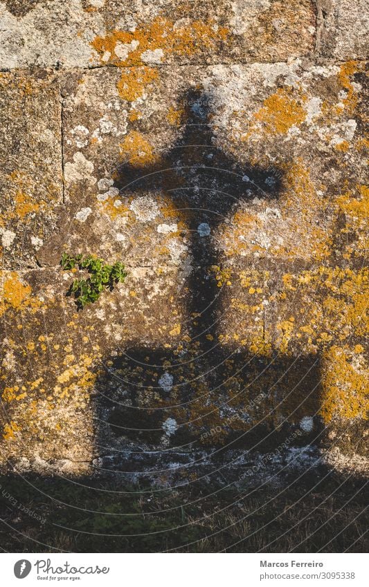 crucifix shadow on stone wall Art Sculpture Sun Church Monument Stone Sign Crucifix Old Historic Retro Death End Serene Religion and faith light tombstone