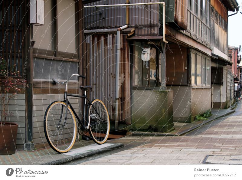 A bicycle stands in a quiet side street in the old town of Kanazawa, Japan Town Old town Deserted Street Sidestreet Bicycle Calm Colour photo Exterior shot Day