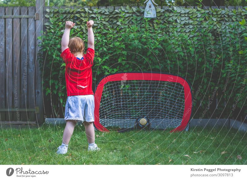 childlike cheering goal Leisure and hobbies Playing Children's game Soccer Garden Sports Ball sports Fan Red-haired Feasts & Celebrations Stand Success