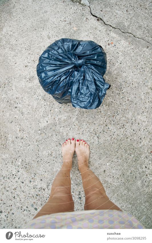 female legs in front of blue garbage bag Trash plastic Environmental pollution Plastic waste Trash container Plastic bag waste disposal Climate change Woman