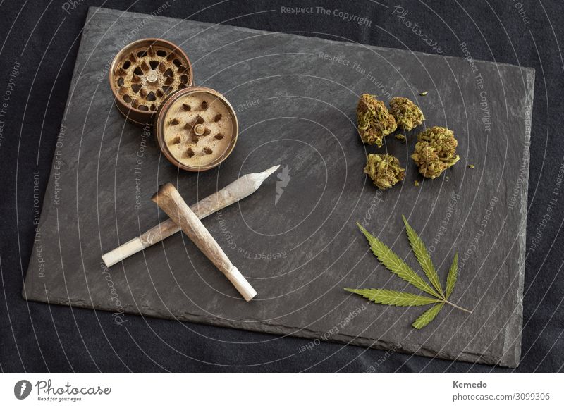 Marijuana joints, cannabis buds and leaf, grinder on black tray Pot Lifestyle Luxury Elegant Style Joy Healthy Medical treatment Alternative medicine Smoking