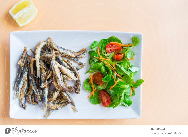 Fried sardines (fish) pescaito frito typical spanish tapa Seafood Bread Lunch Dinner Diet Plate Wood Fresh Blue White anchovies anchovy appetizer background