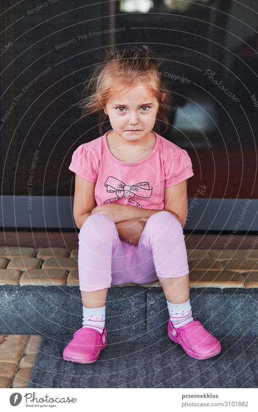 Little sad girl crying because of lost her toy, sitting on a step on the patio. Real people, authentic situations Child Human being Girl Infancy 1 3 - 8 years