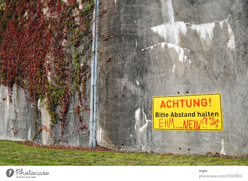 Warning with contradiction on bunker wall Dugout Concrete Signs and labeling Signage Disagreement Colour photo Deserted Warning sign Exterior shot Warning label