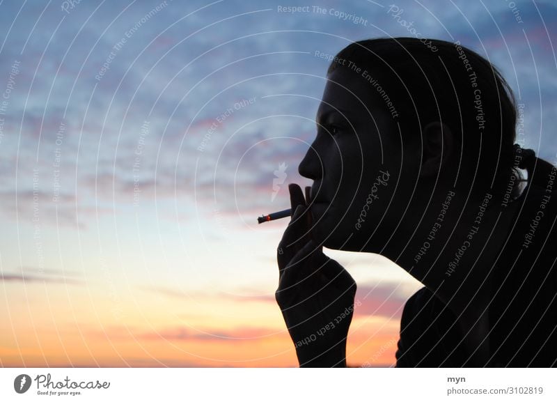 Silhouette of a smoking woman before sunset Smoking Sky Profile Cigarette Head Clouds Youth (Young adults) Orange Blue Adults Mouth Colour photo Twilight Sunset