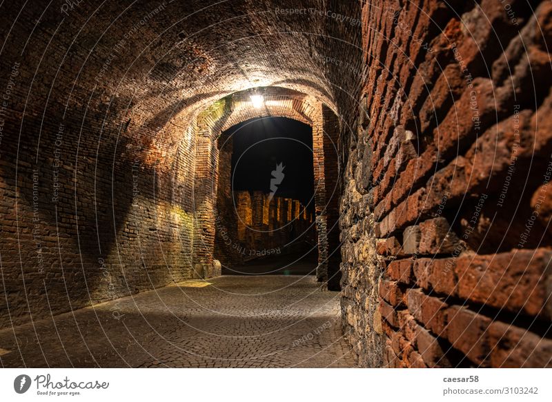 Medieval Passage to the old Castelvecchio Bridge over the Adige River at Night, Verona, Italy castelvecchio castle middle ages night italy gate entrance