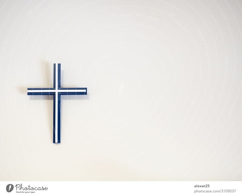 Blue and white catholic cross on a wall with copy space Easter Plastic Hope Death Belief Religion and faith background Catholicism christ Christianity